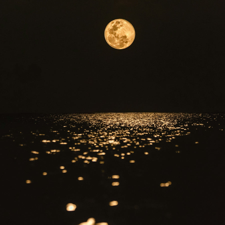 Candle scent inspiration; Full moon shimmering and reflecting over water