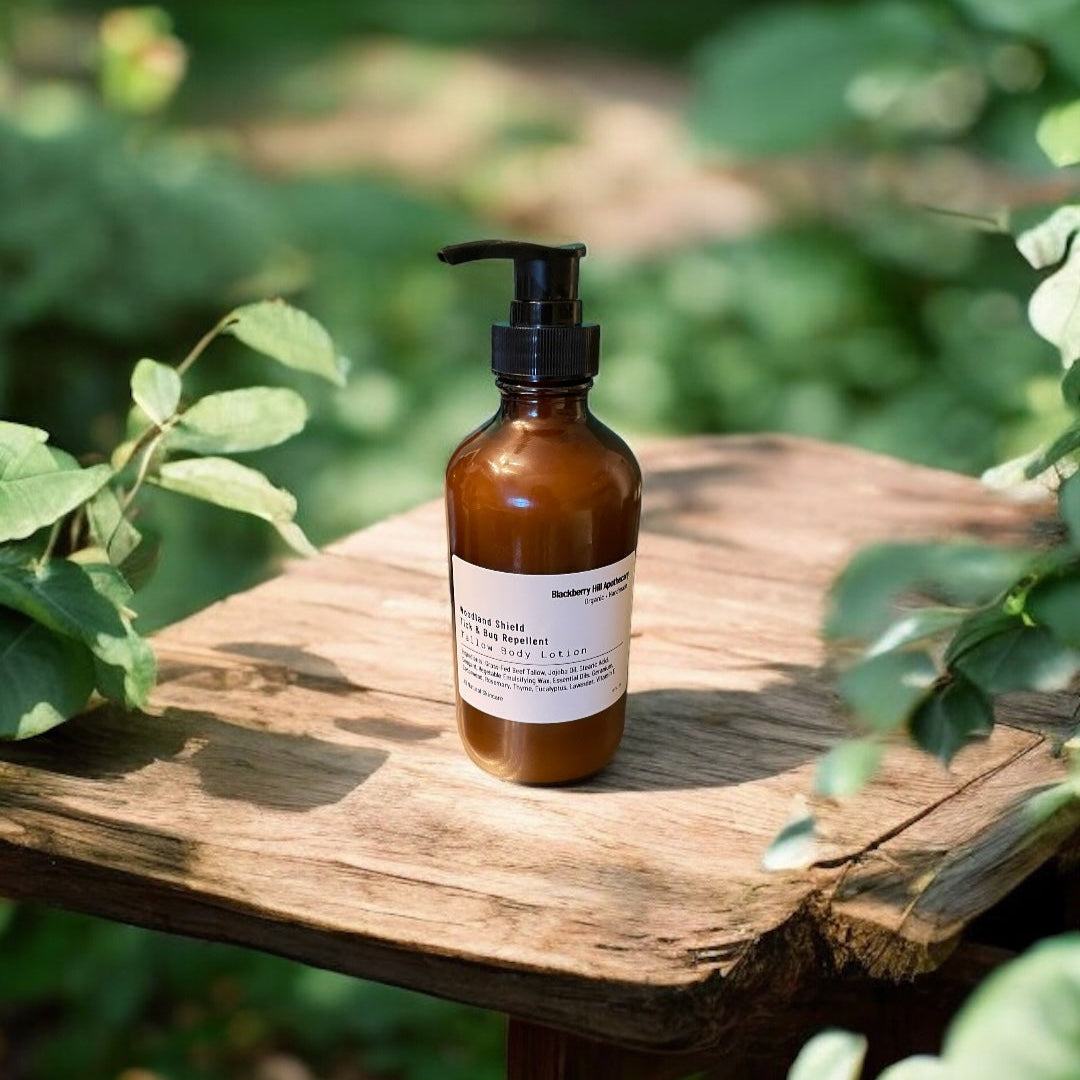 Brown bottle with pump on a wooden table surrounded by green foliage